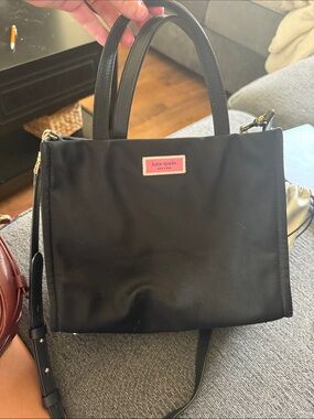 kate spade black nylon satchel with pink logo plaque